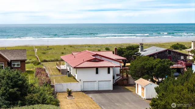 an aerial view of a house with a ocean view
