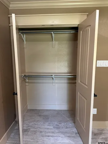 a view of a room with wooden floor and staircase
