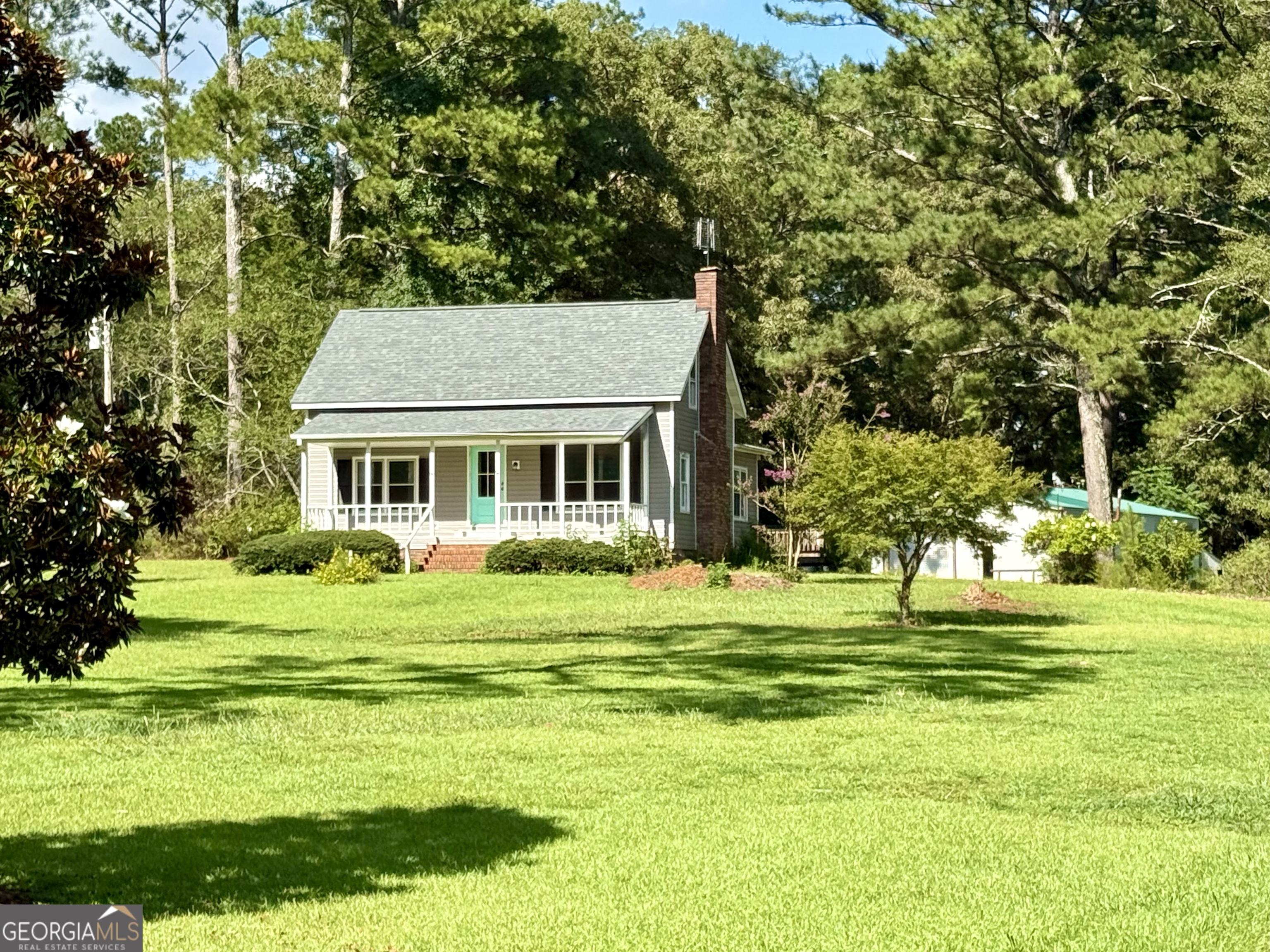 4170 Hollonville Road Williamson, GA 30292 - Photo 107 of 132 a front view of a house with a garden