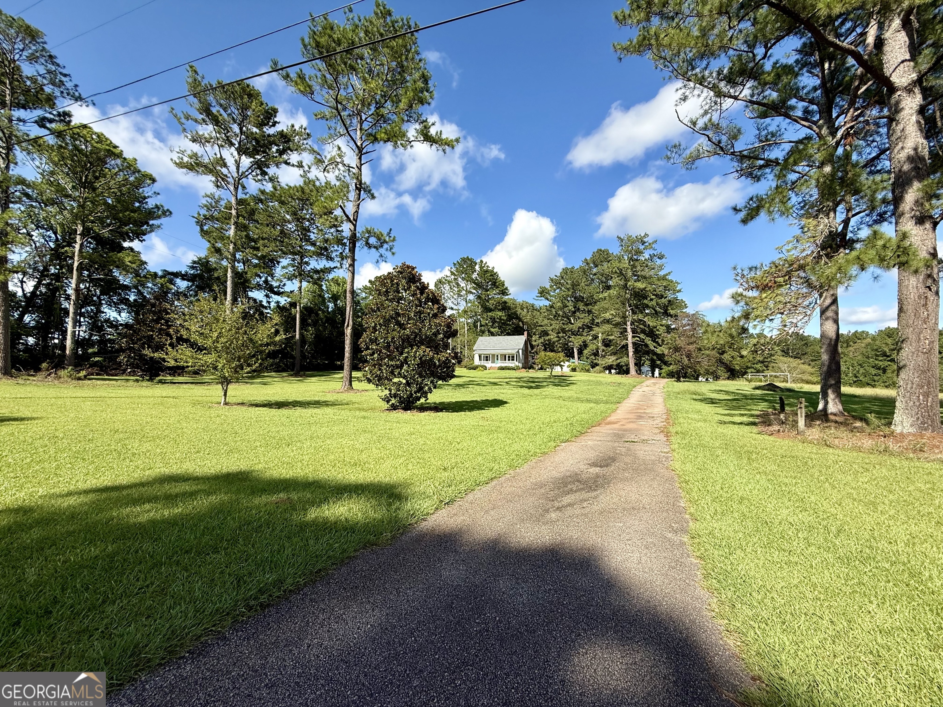 4170 Hollonville Road Williamson, GA 30292 - Photo 108 of 132 a view of a playground with basketball court