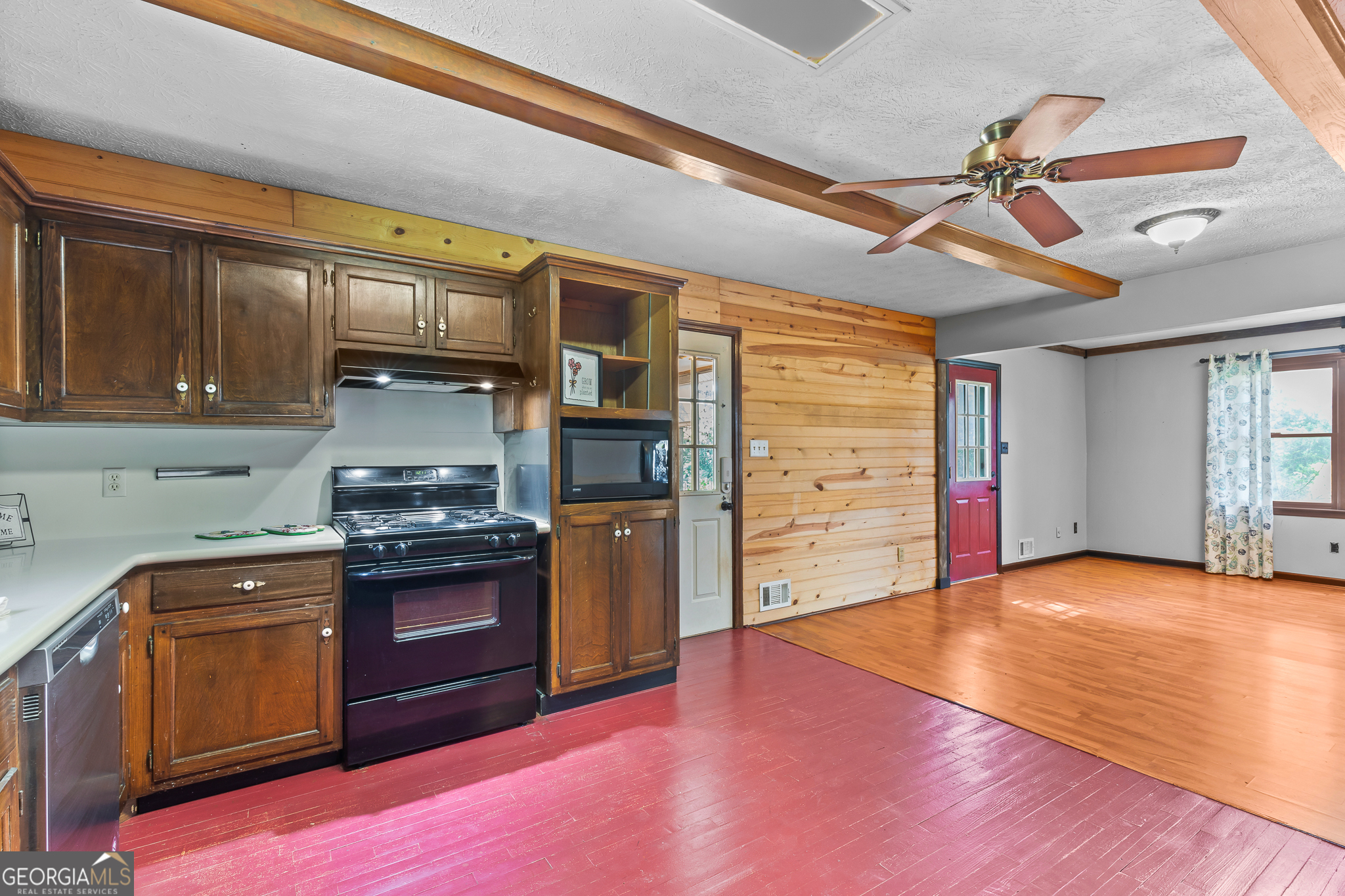 4170 Hollonville Road Williamson, GA 30292 - Photo 17 of 132 a kitchen with stainless steel appliances granite countertop a stove cabinets and wooden floor
