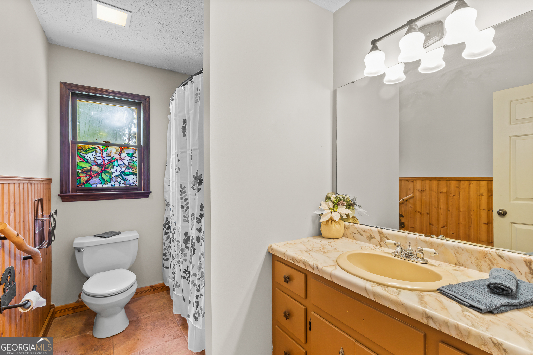 4170 Hollonville Road Williamson, GA 30292 - Photo 18 of 132 a bathroom with a toilet sink and mirror