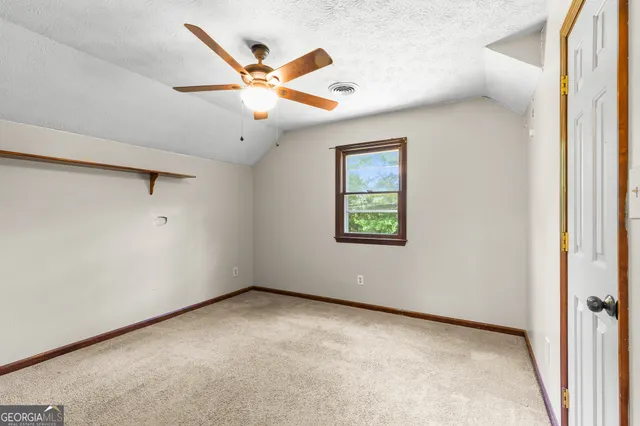 a swimming pool with trees in the background