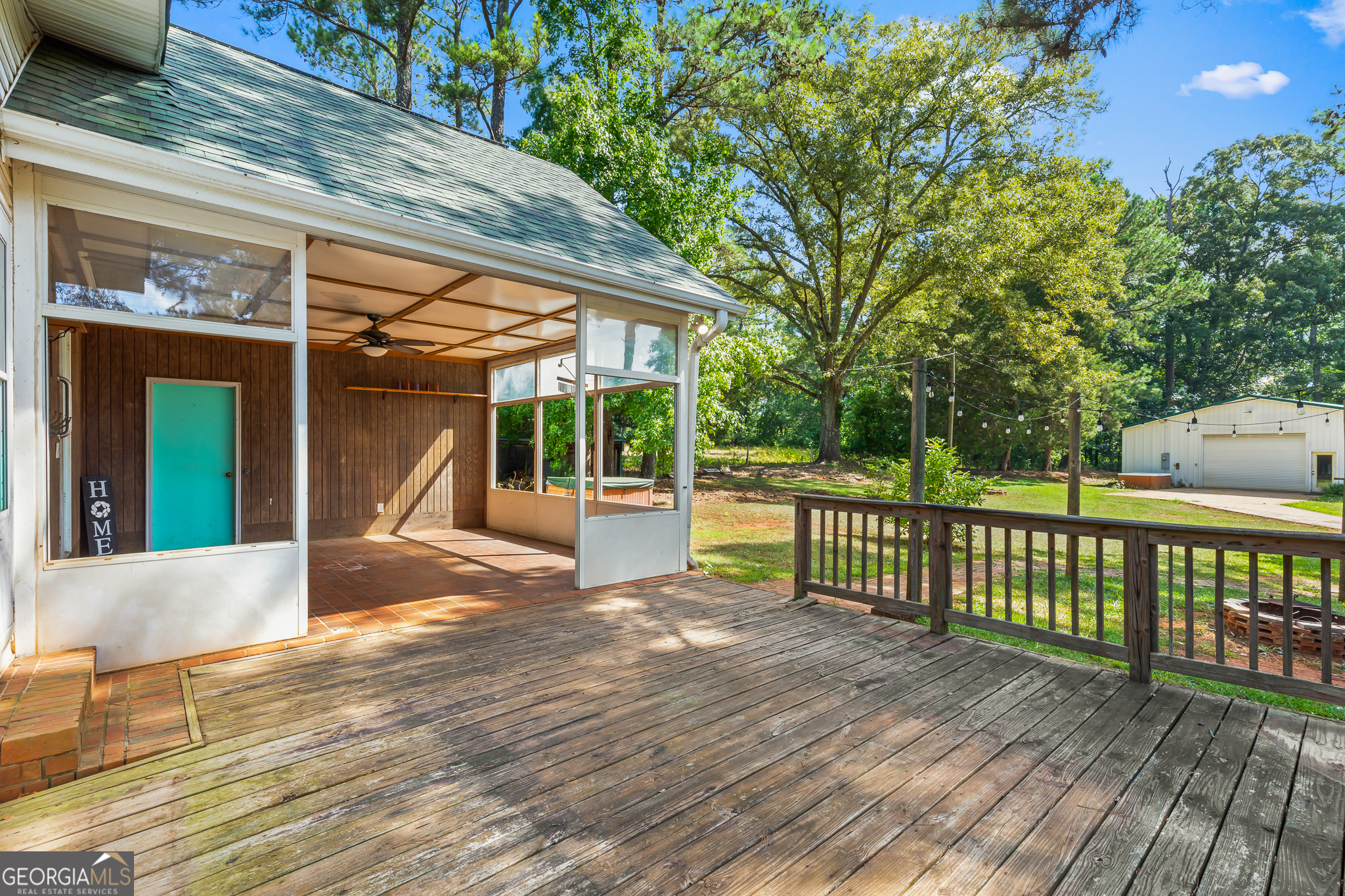 4170 Hollonville Road Williamson, GA 30292 - Photo 41 of 132 a view of a patio with a table and chairs next to a yard