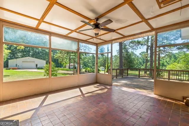 a view of a house with a door and deck