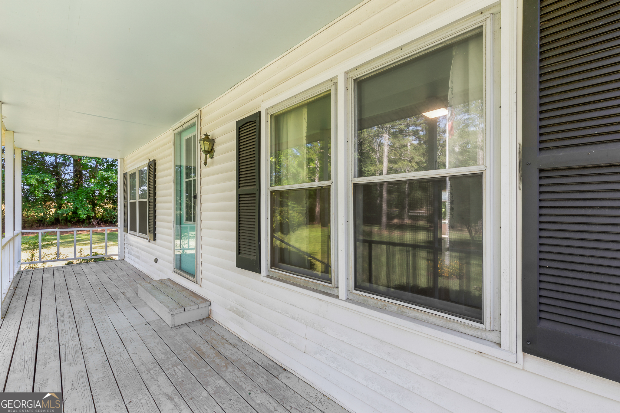 4170 Hollonville Road Williamson, GA 30292 - Photo 5 of 132 a view of backyard with wooden floor and floor to ceiling window