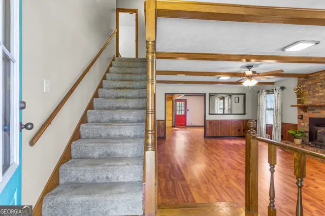a kitchen with stainless steel appliances granite countertop a stove cabinets and wooden floor