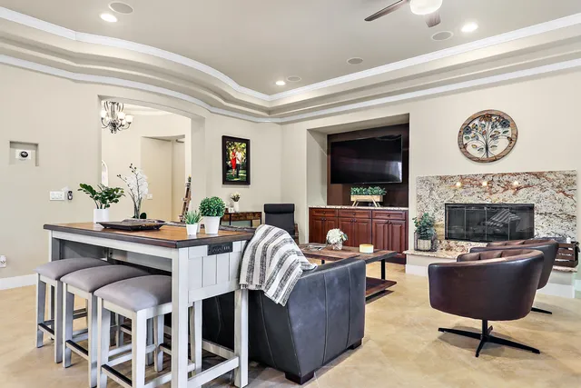 a kitchen with stainless steel appliances granite countertop wooden cabinets a stove a sink and a refrigerator