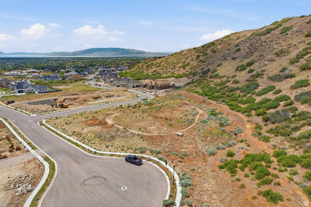 1817 North Dean Court, Unit 12 Alpine, UT 84004 - Photo 28 of 38 Expansive hillside development featuring new construction homes, paved roads, and a mountainous backdrop