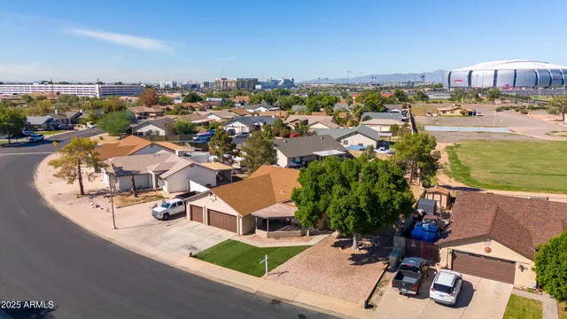 an aerial view of a house with outdoor space swimming pool and ocean view