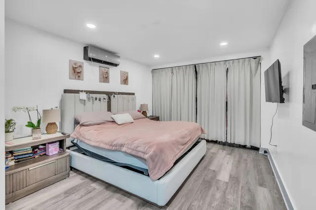 a bed room with a bed and a walk in closet