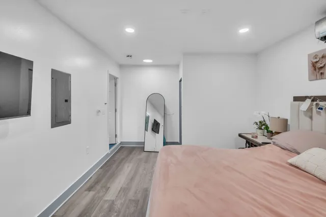 a bedroom with a bed and a dresser