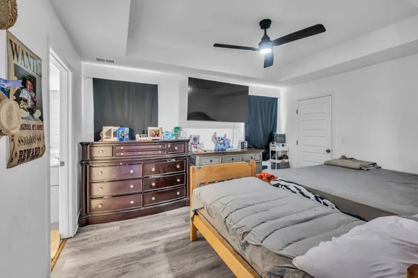 a bed room with a bed and a television