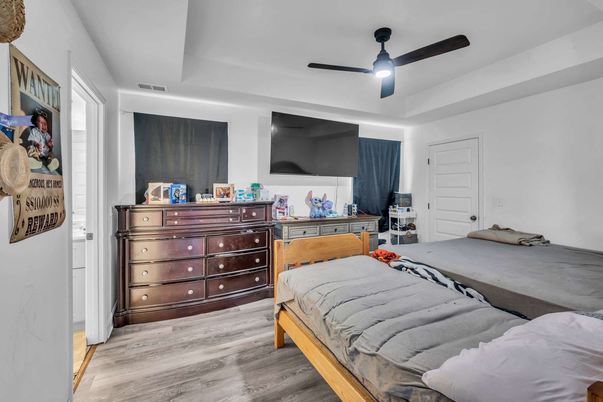 412 Larkin Springs Road Madison, TN 37115 - Photo 16 of 29 a bed room with a bed and a television