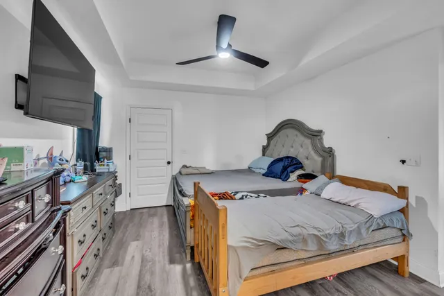 a bed sitting in a bedroom next to a window