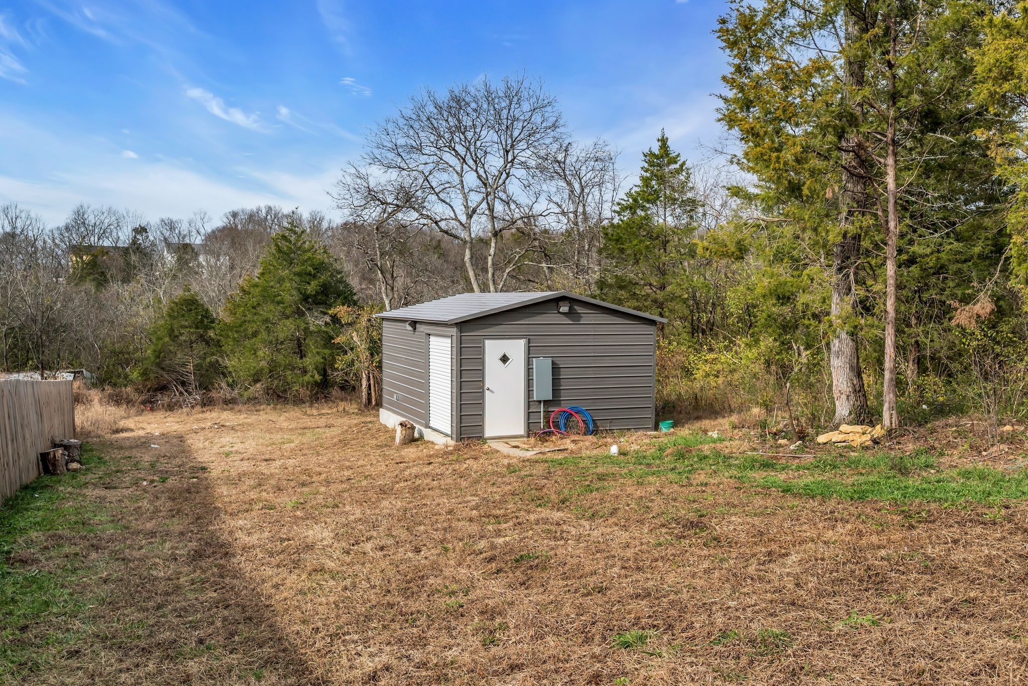 412 Larkin Springs Road Madison, TN 37115 - Photo 27 of 29 a white house that has a tree in front of it