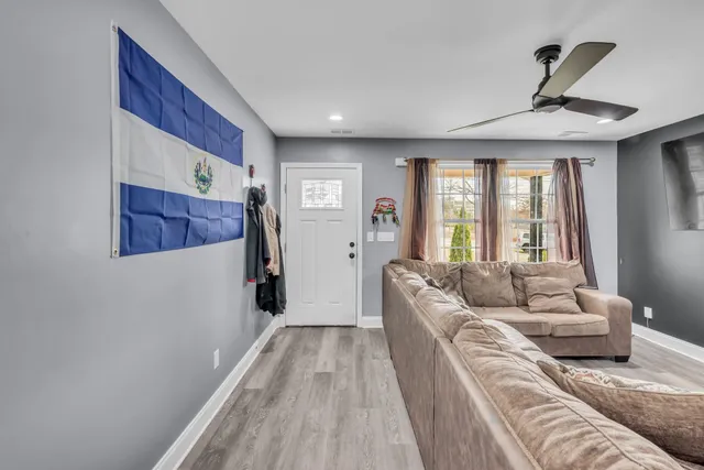 a living room with furniture and a large window