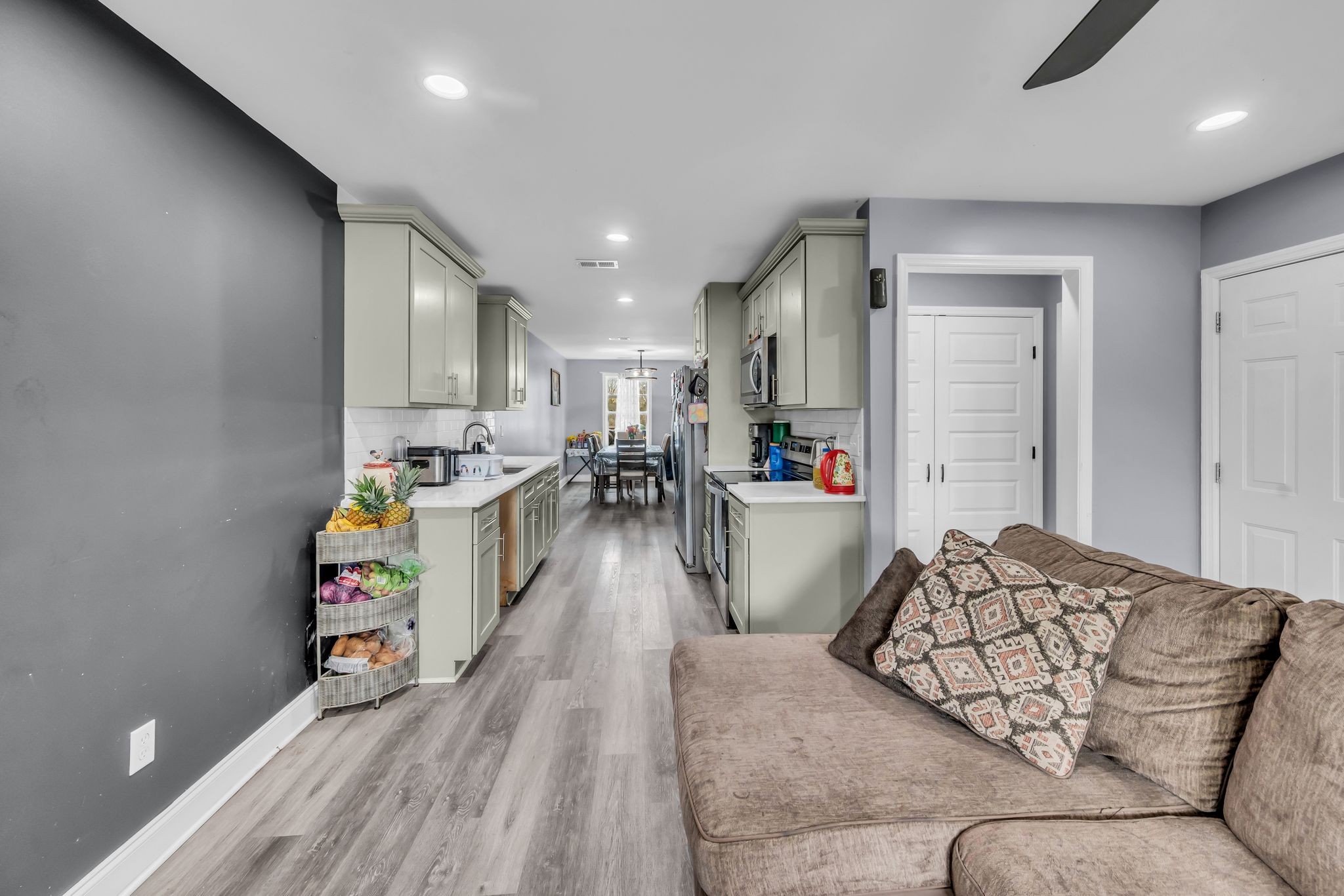 412 Larkin Springs Road Madison, TN 37115 - Photo 7 of 29 a living room with furniture and a wooden floor