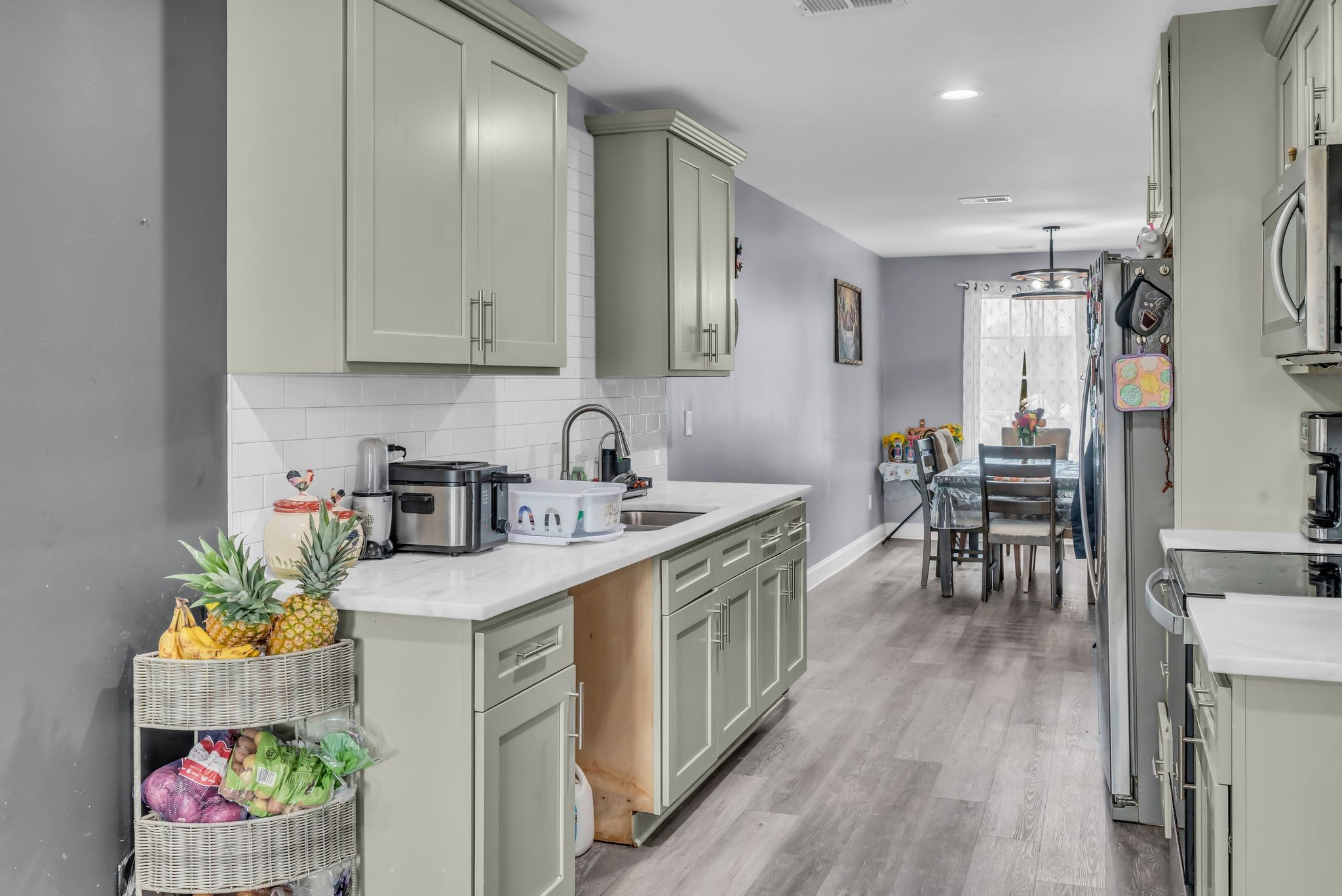 412 Larkin Springs Road Madison, TN 37115 - Photo 9 of 29 a kitchen with a sink stove and cabinets