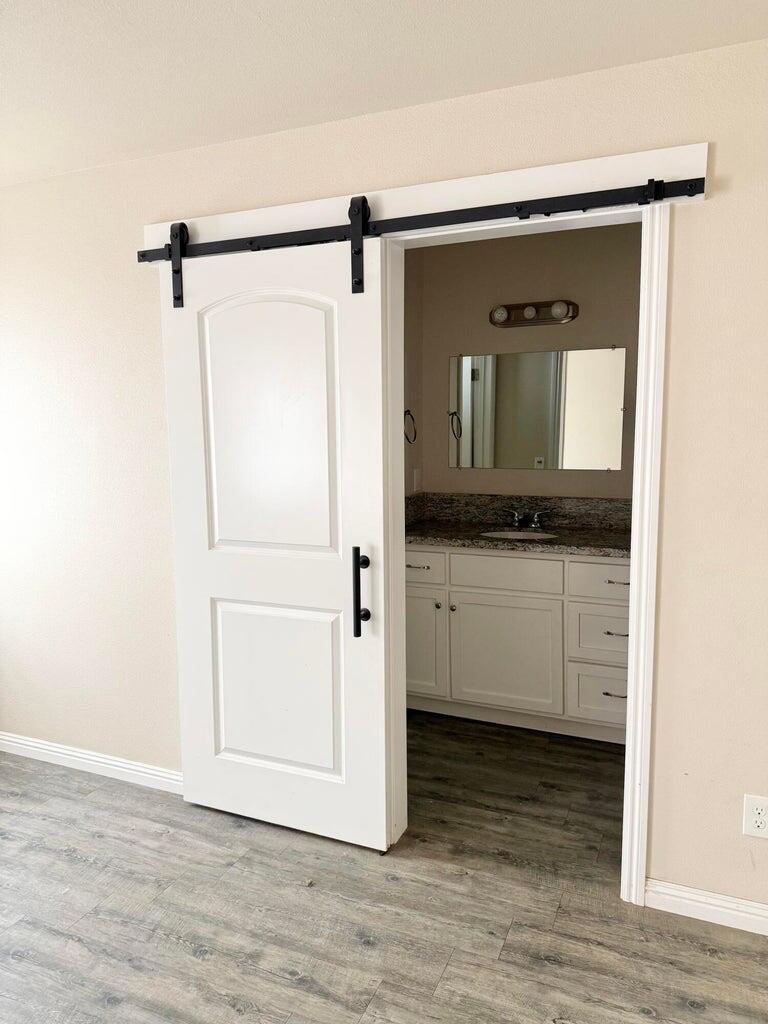 1310 North Belmont Road Exeter, CA 93221 - Photo 8 of 15 a bathroom with a granite countertop sink and mirror