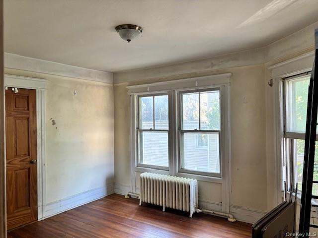 761 East Main Street Riverhead, NY 11901 - Photo 13 of 17 a view of an empty room with a window and wooden floor