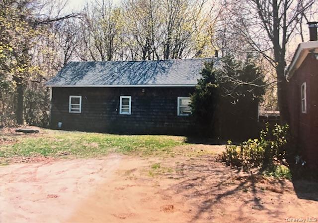 761 East Main Street Riverhead, NY 11901 - Photo 16 of 17 a front view of a house with a yard