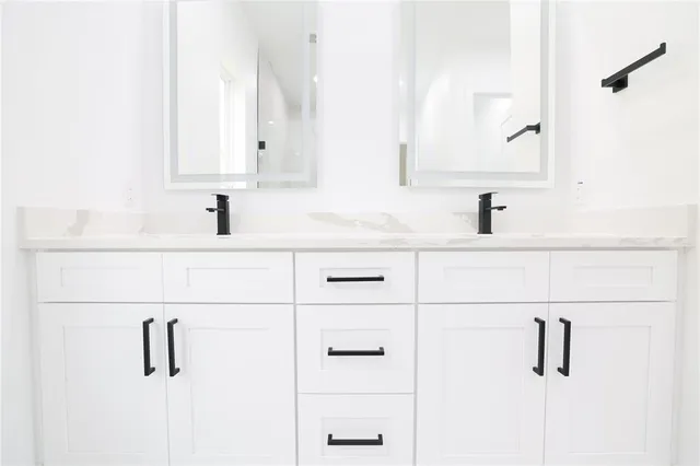 a bathroom with a sink and mirror
