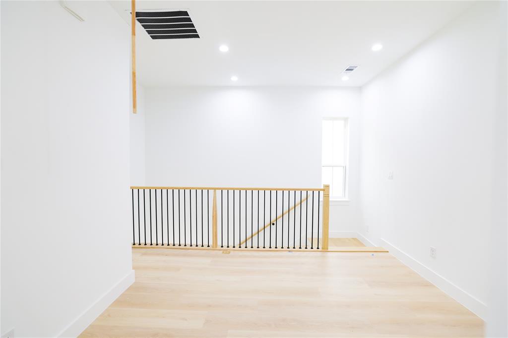 302 East 7th Street, Unit B Dallas, TX 75203 - Photo 8 of 15 a view of a room with a wooden floor