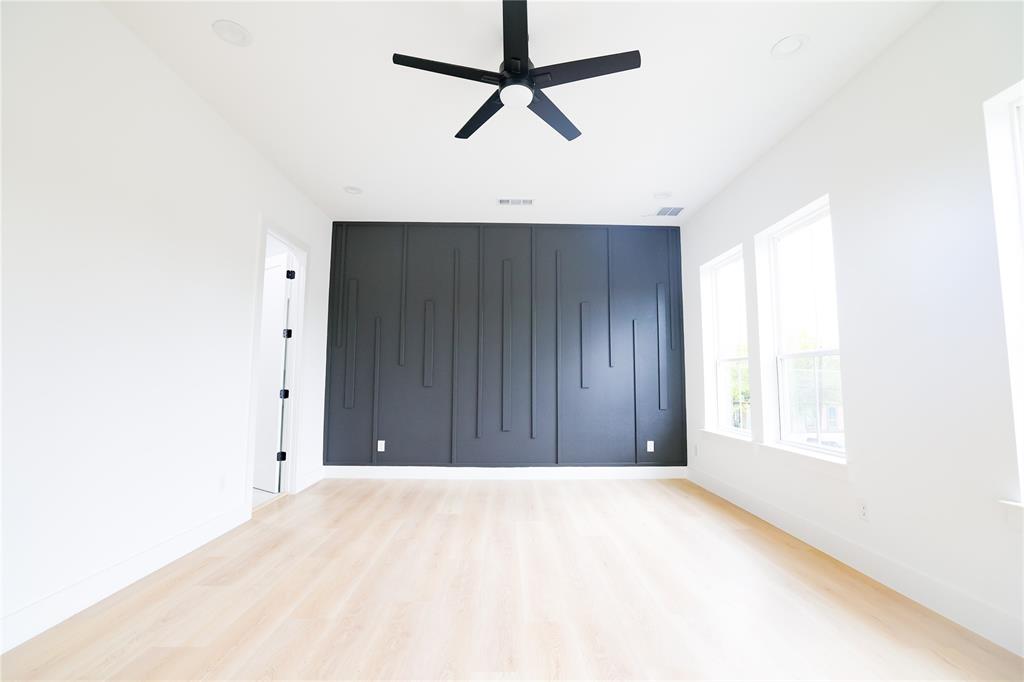 302 East 7th Street, Unit B Dallas, TX 75203 - Photo 10 of 15 a view of a room with a window and a ceiling fan