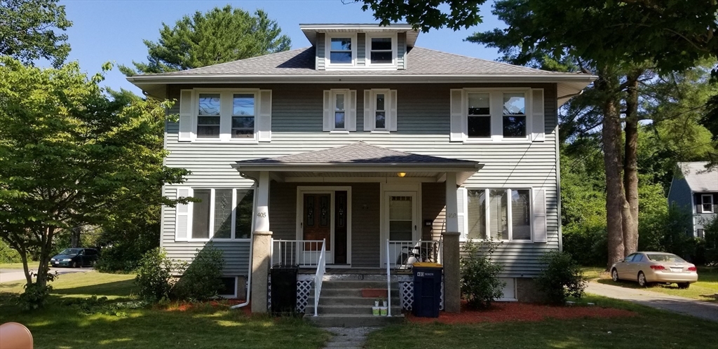 403 South Main Street, Unit 1 Sharon, MA 02067 - Photo 1 of 16 a front view of a house with garden