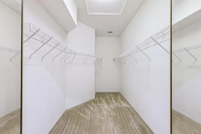 a bathroom with a double vanity sink mirror and bathtub