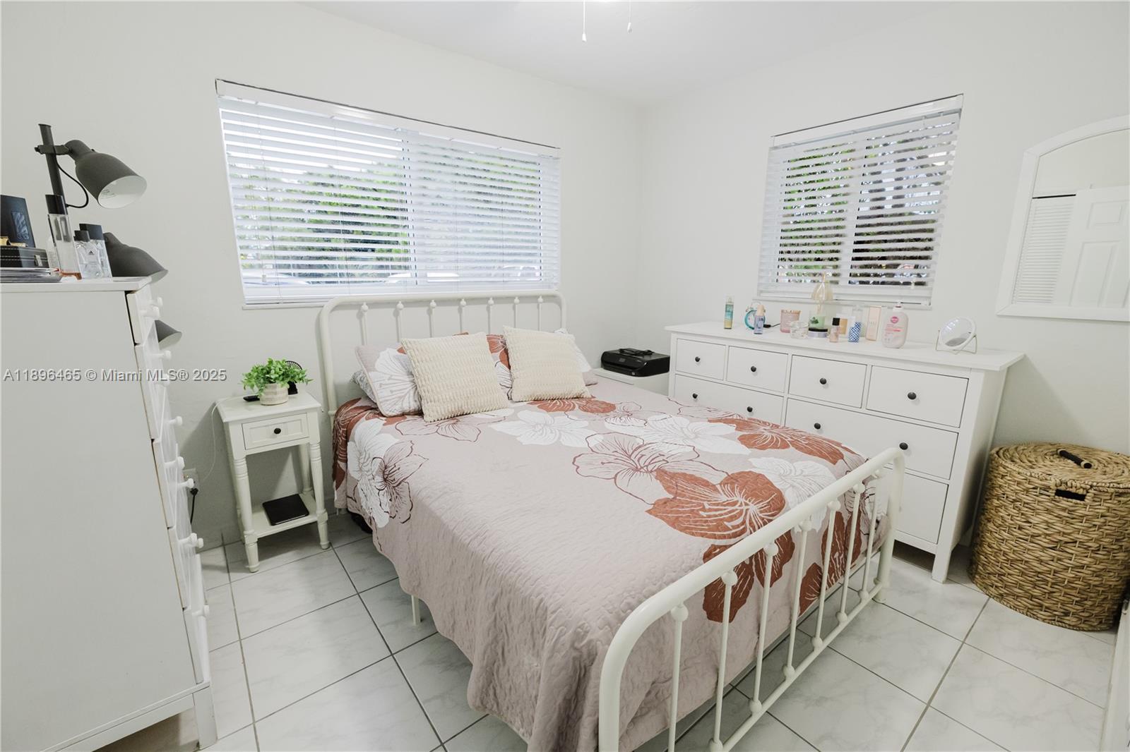 2211 Southwest 75th Avenue, Unit 1 Miami, FL 33155 - Photo 4 of 9 a bedroom with a bed and a window