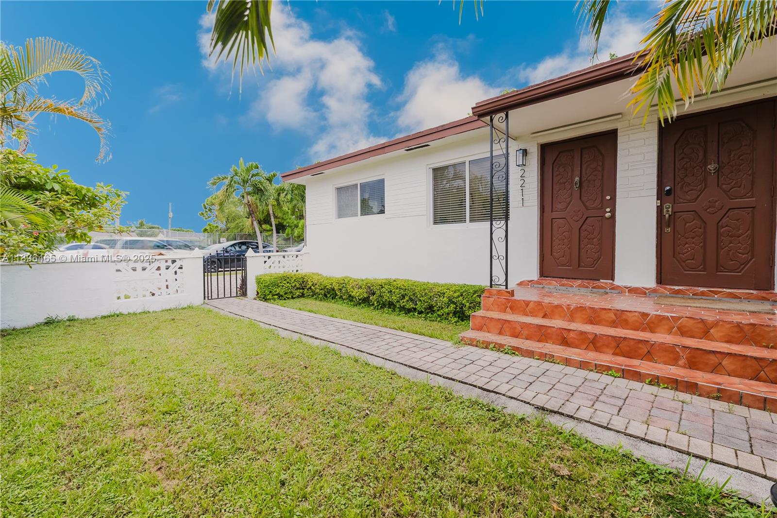 2211 Southwest 75th Avenue, Unit 1 Miami, FL 33155 - Photo 8 of 9 a front view of a house with a garden