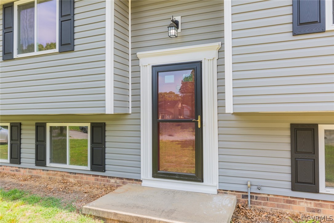 6420 Husting Road Chesterfield, VA 23832 - Photo 4 of 45 a front view of a house with a garage
