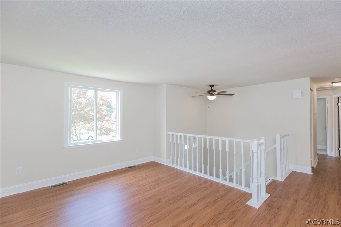 6420 Husting Road Chesterfield, VA 23832 - Photo 8 of 45 a view of a livingroom with wooden floor and a ceiling fan