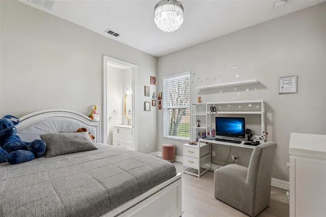 a bedroom with a bed and a fireplace