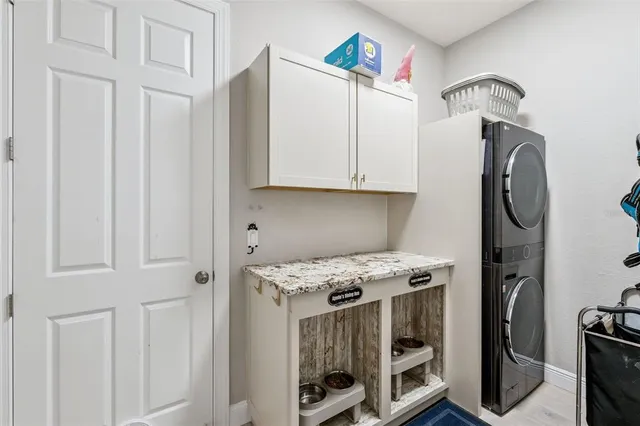 a kitchen with stainless steel appliances granite countertop a stove and a refrigerator