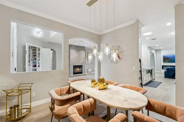 a living room with furniture and a dining table
