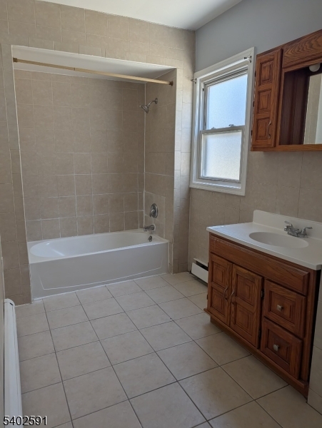 313 Palmer Street Elizabeth, NJ 07202 - Photo 10 of 15 a bathroom with a granite countertop sink a mirror and a bathtub