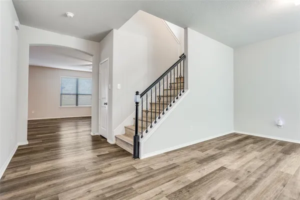 a view of entryway with wooden floor