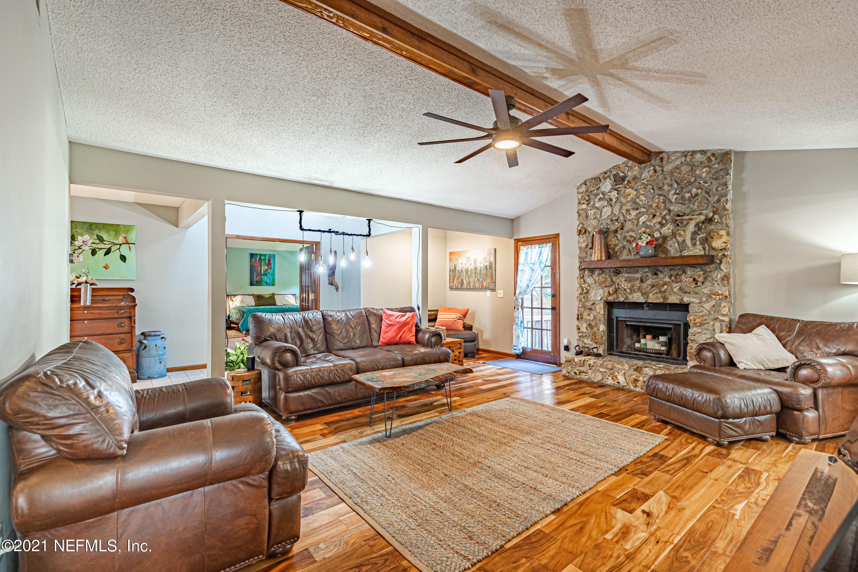 12825 Ridgemore Lane Jacksonville, FL 32258 - Photo 11 of 37 a living room with furniture and a fireplace