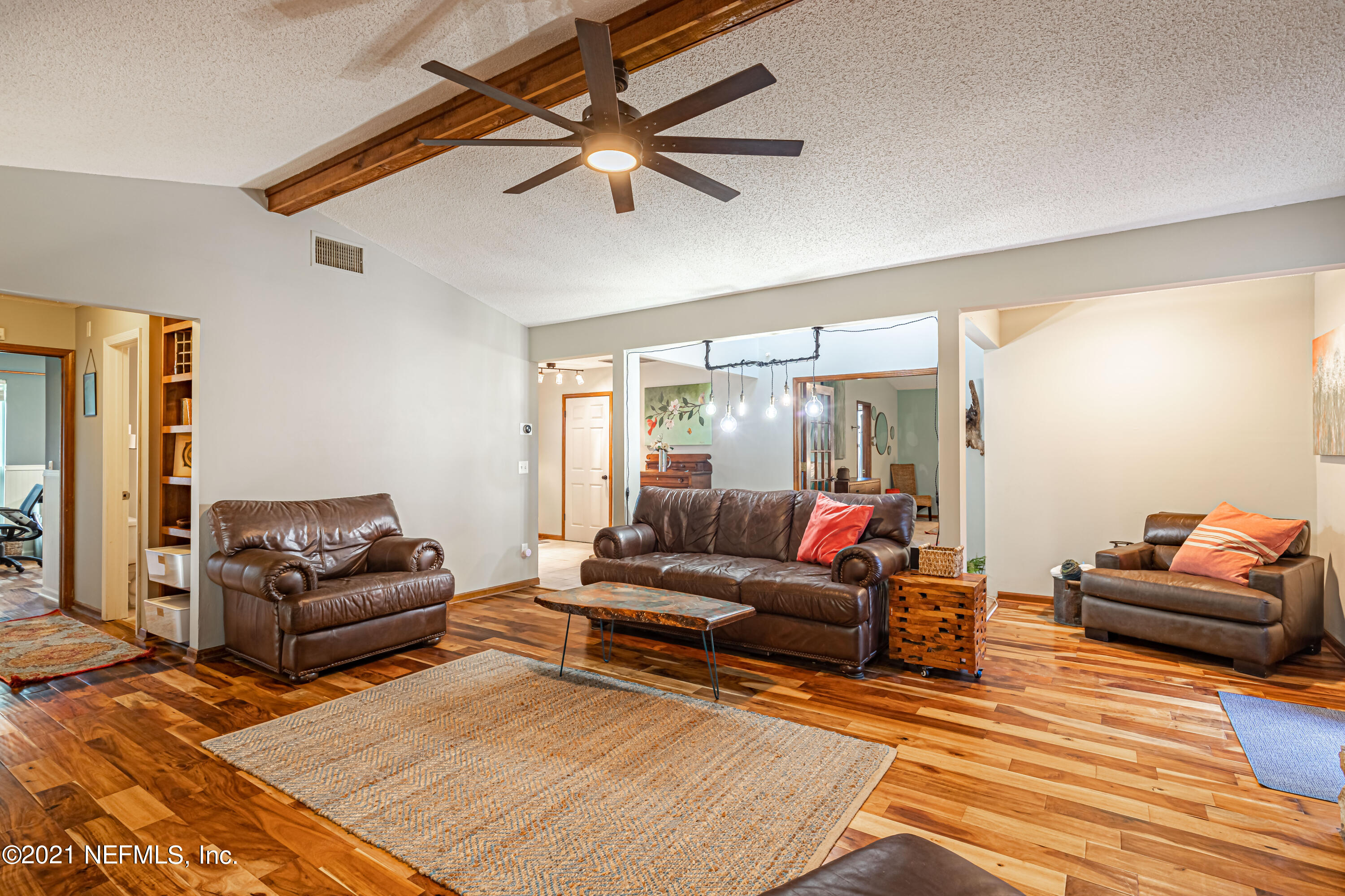 12825 Ridgemore Lane Jacksonville, FL 32258 - Photo 12 of 37 a living room with furniture and a wooden floor