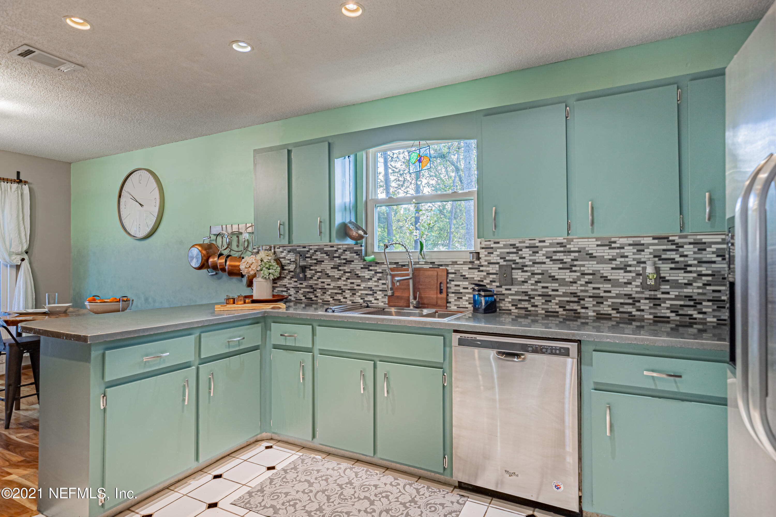 12825 Ridgemore Lane Jacksonville, FL 32258 - Photo 13 of 37 a kitchen with a sink and cabinets