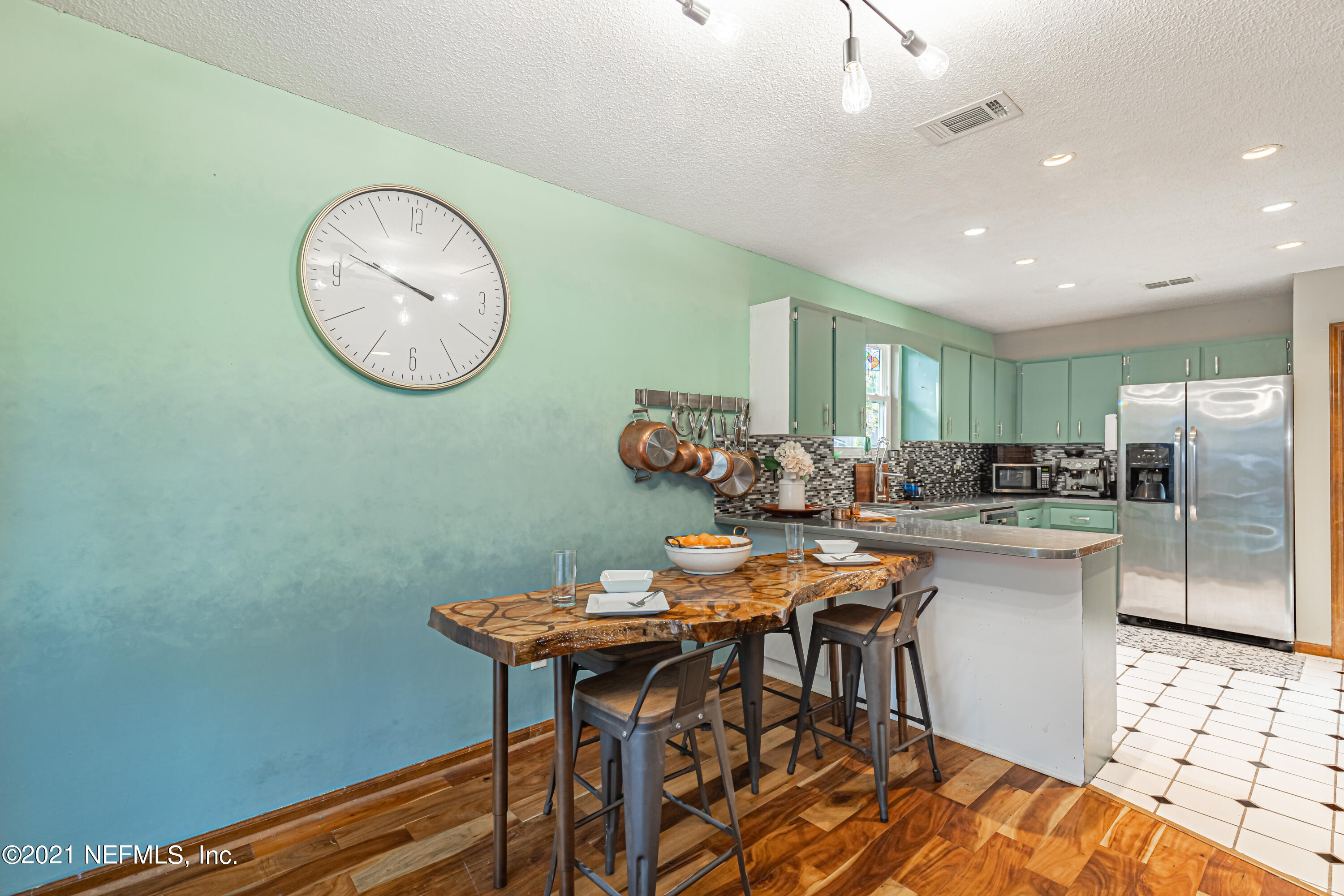 12825 Ridgemore Lane Jacksonville, FL 32258 - Photo 16 of 37 a kitchen with a table and chairs in it