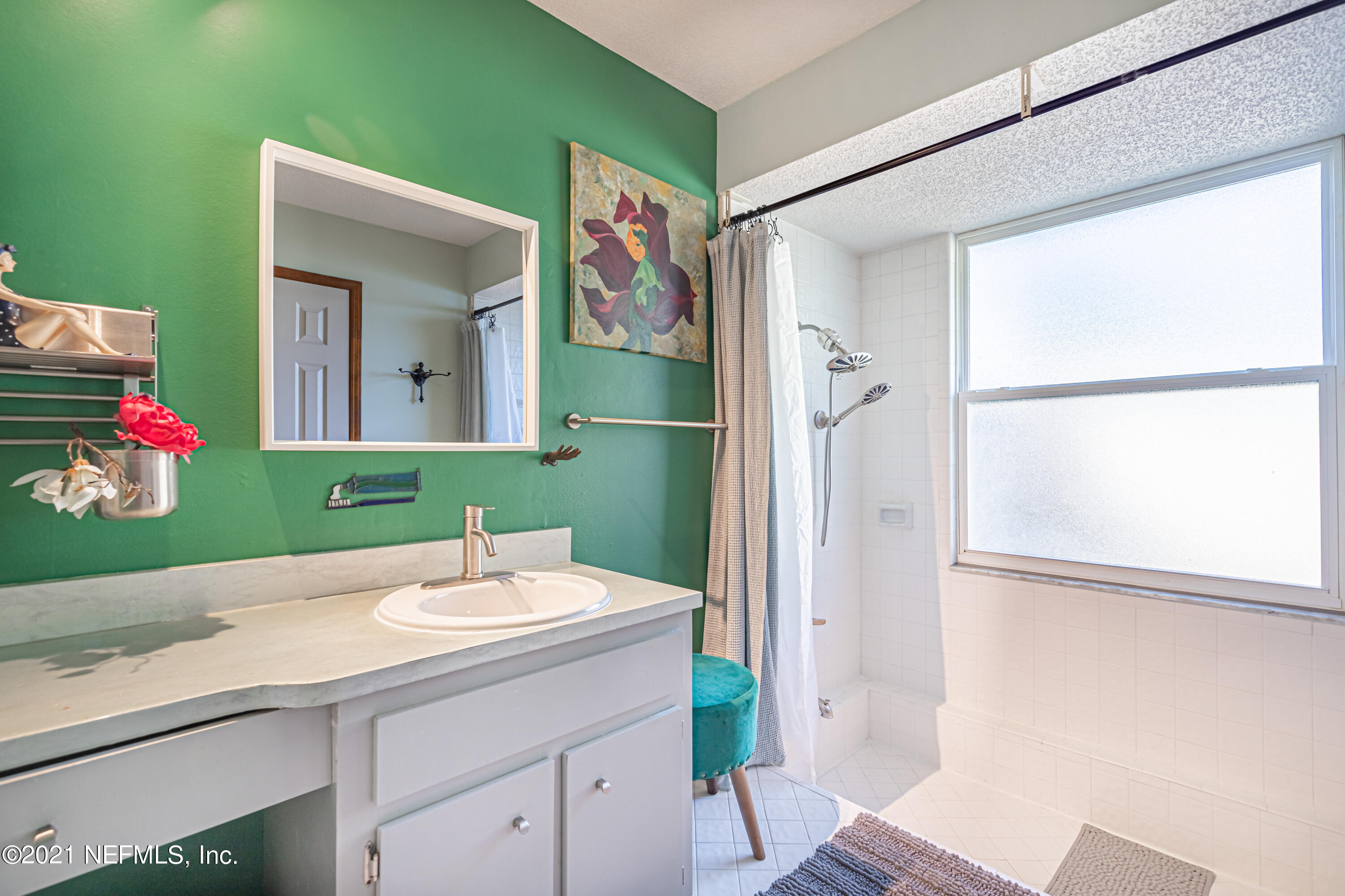 12825 Ridgemore Lane Jacksonville, FL 32258 - Photo 21 of 37 a bathroom with a sink and a mirror