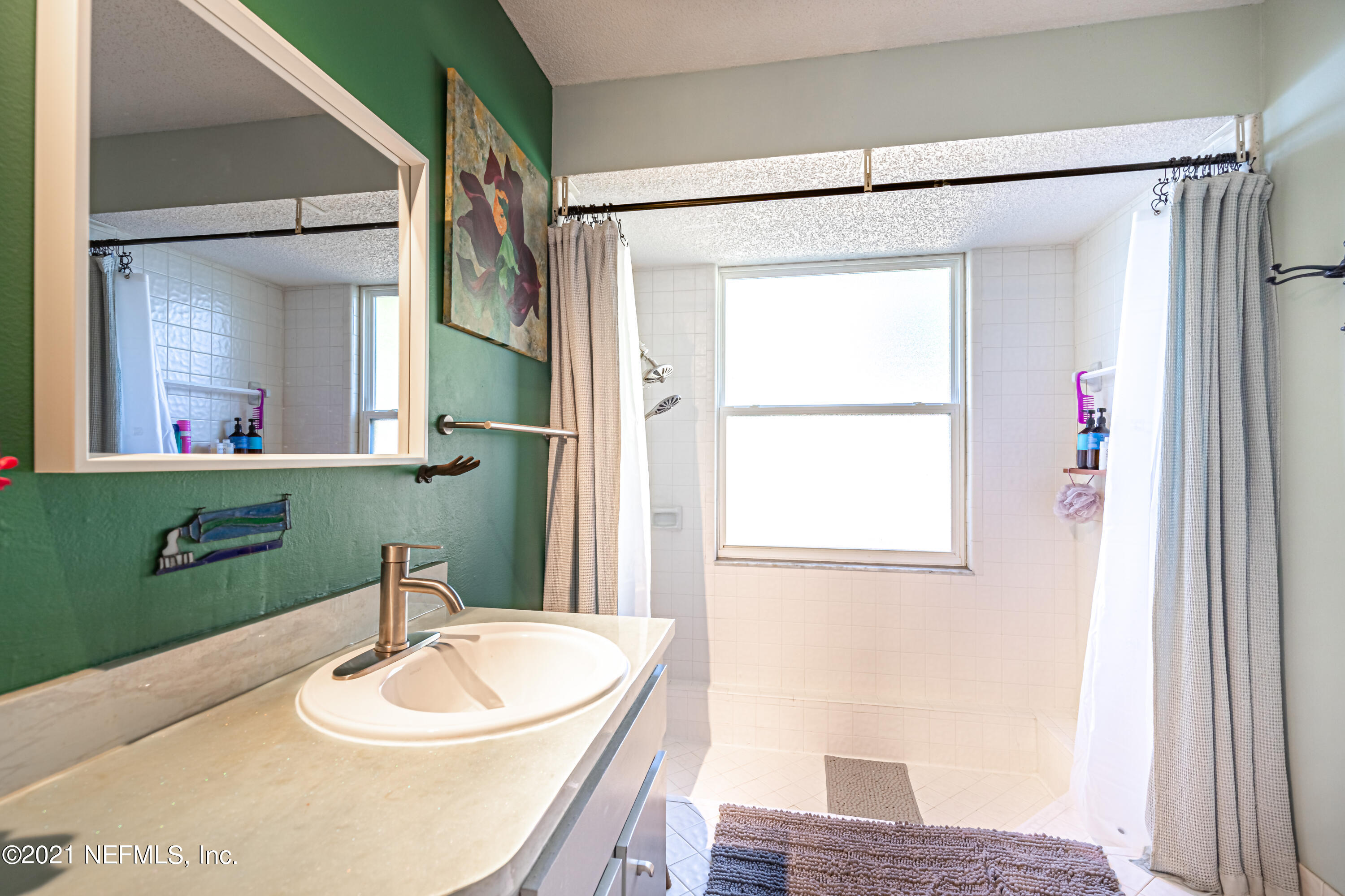 12825 Ridgemore Lane Jacksonville, FL 32258 - Photo 23 of 37 a bathroom with a sink a toilet and a mirror