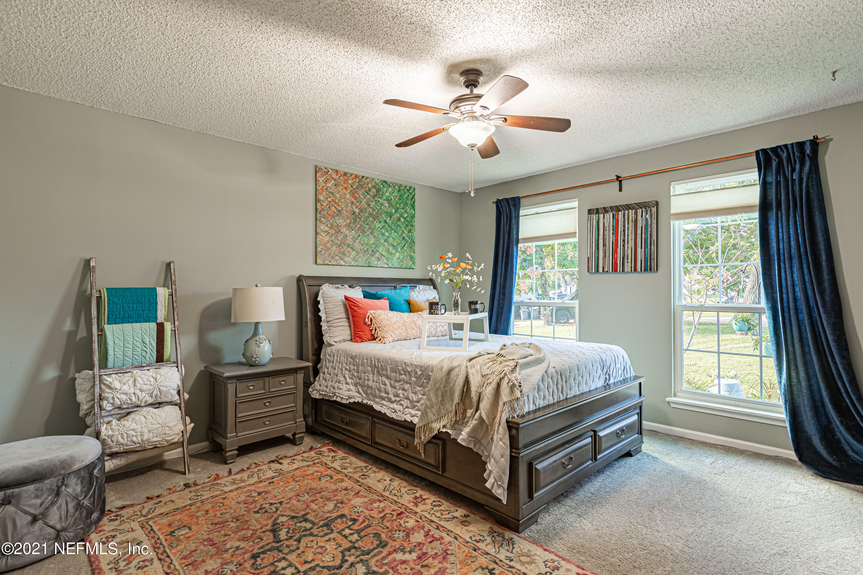 12825 Ridgemore Lane Jacksonville, FL 32258 - Photo 24 of 37 a bed room with a bed and a chandelier