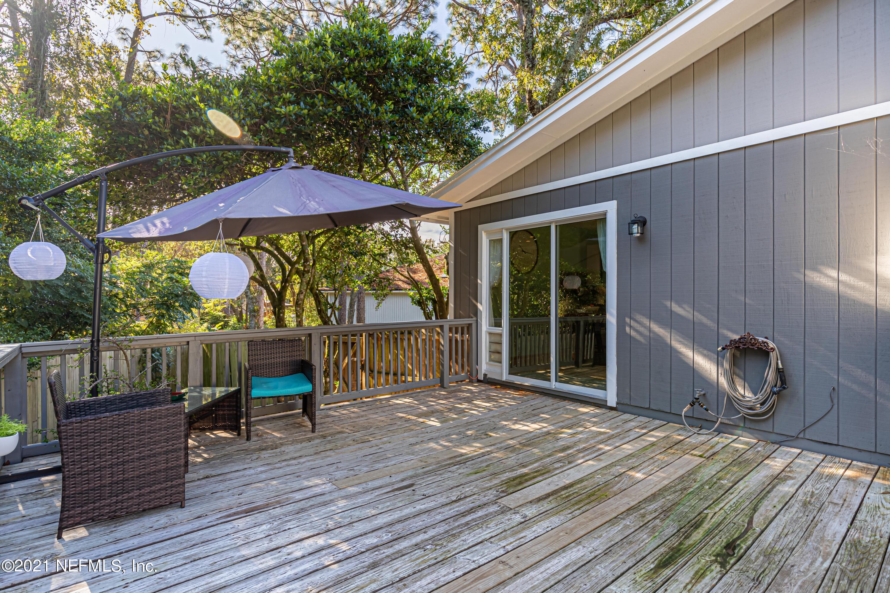 12825 Ridgemore Lane Jacksonville, FL 32258 - Photo 26 of 37 a balcony with furniture and wooden floor