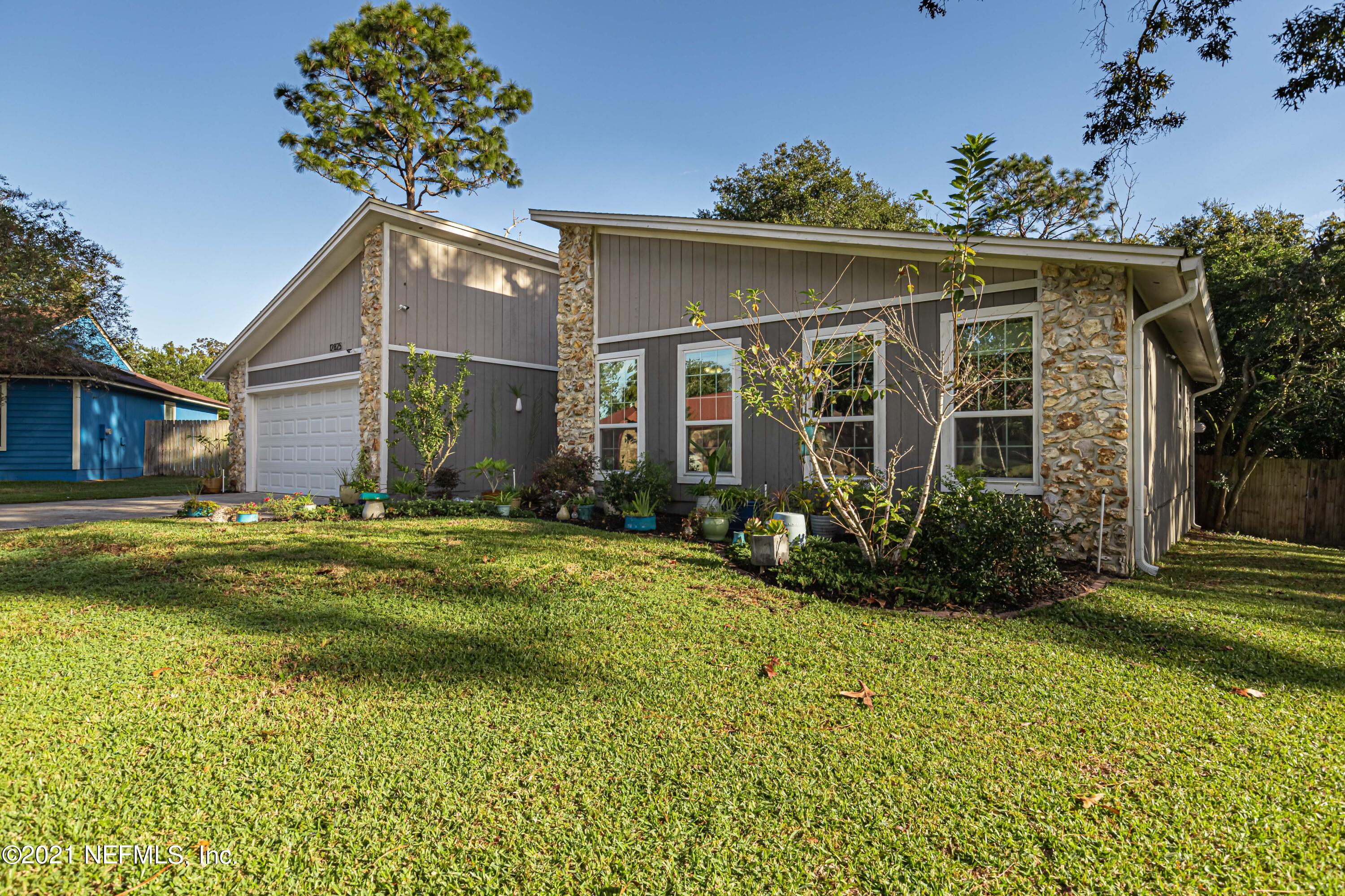 12825 Ridgemore Lane Jacksonville, FL 32258 - Photo 3 of 37 a front view of a house with a yard