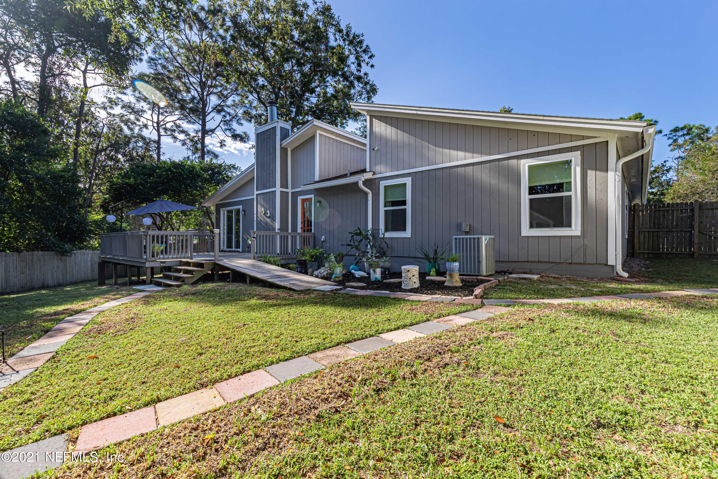 12825 Ridgemore Lane Jacksonville, FL 32258 - Photo 32 of 37 a view of house with swimming pool outdoor seating